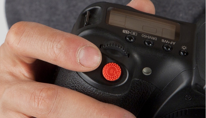 Enjoy A No-Slip Finger Grip With Shutter Button Sticker Called "ProDot"