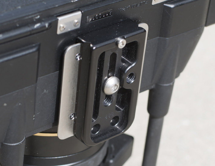 I use a Really Right Stuff plate and large ball head to hold the kit together, though I'm sure you could get away with less if you're not pushing the angle on the tripod too much.