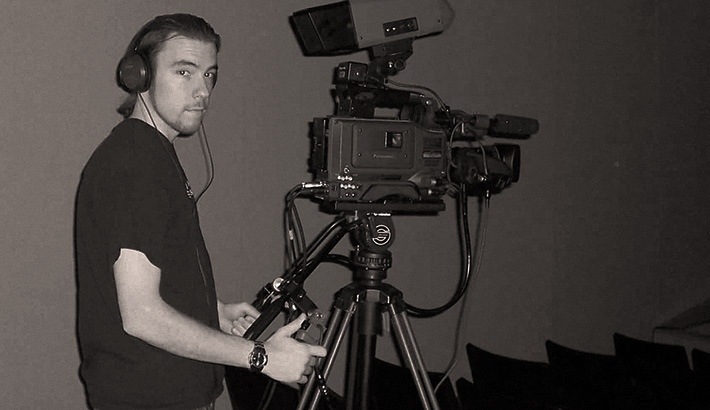 Here is an unfortunate photo of me with a pony tail, working as a part time camera op doing event videography.